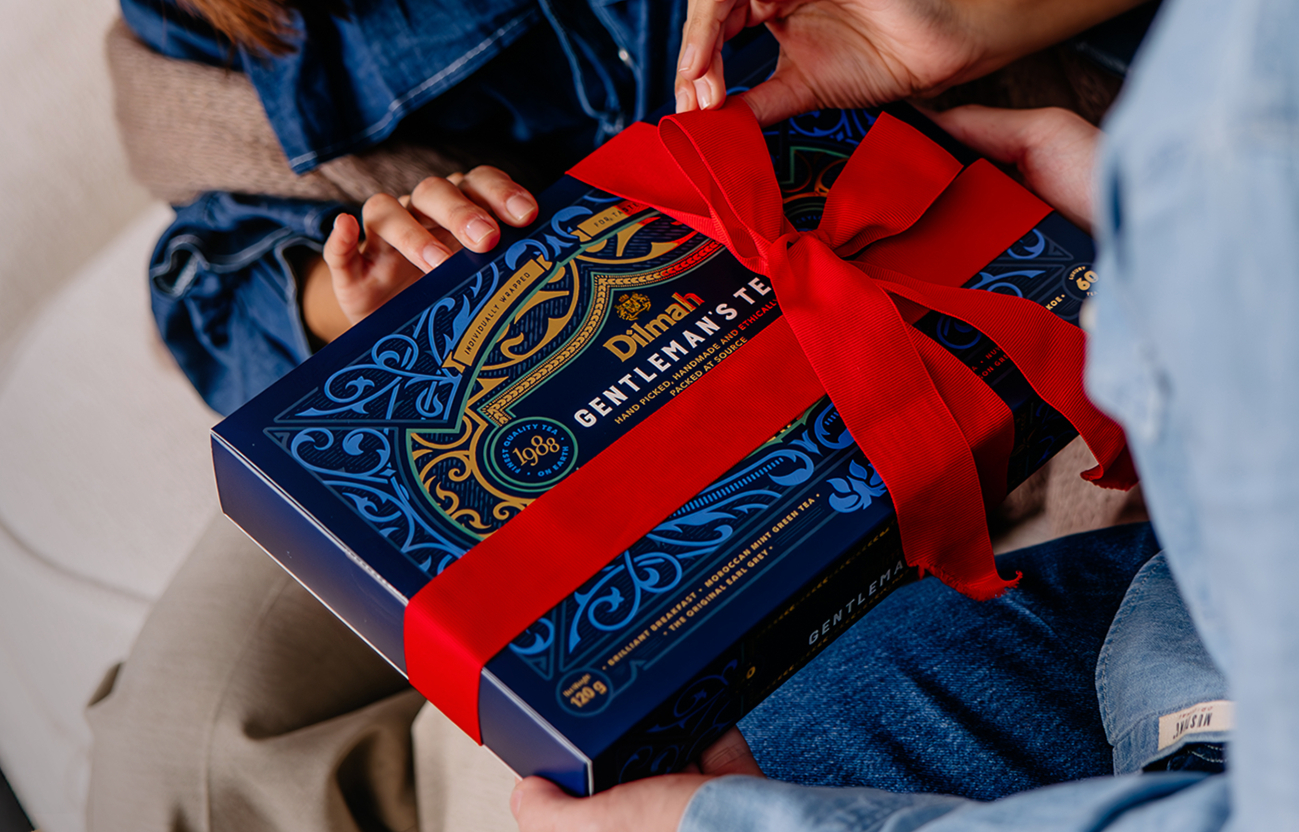Premium tea gift packaging on a wooden table