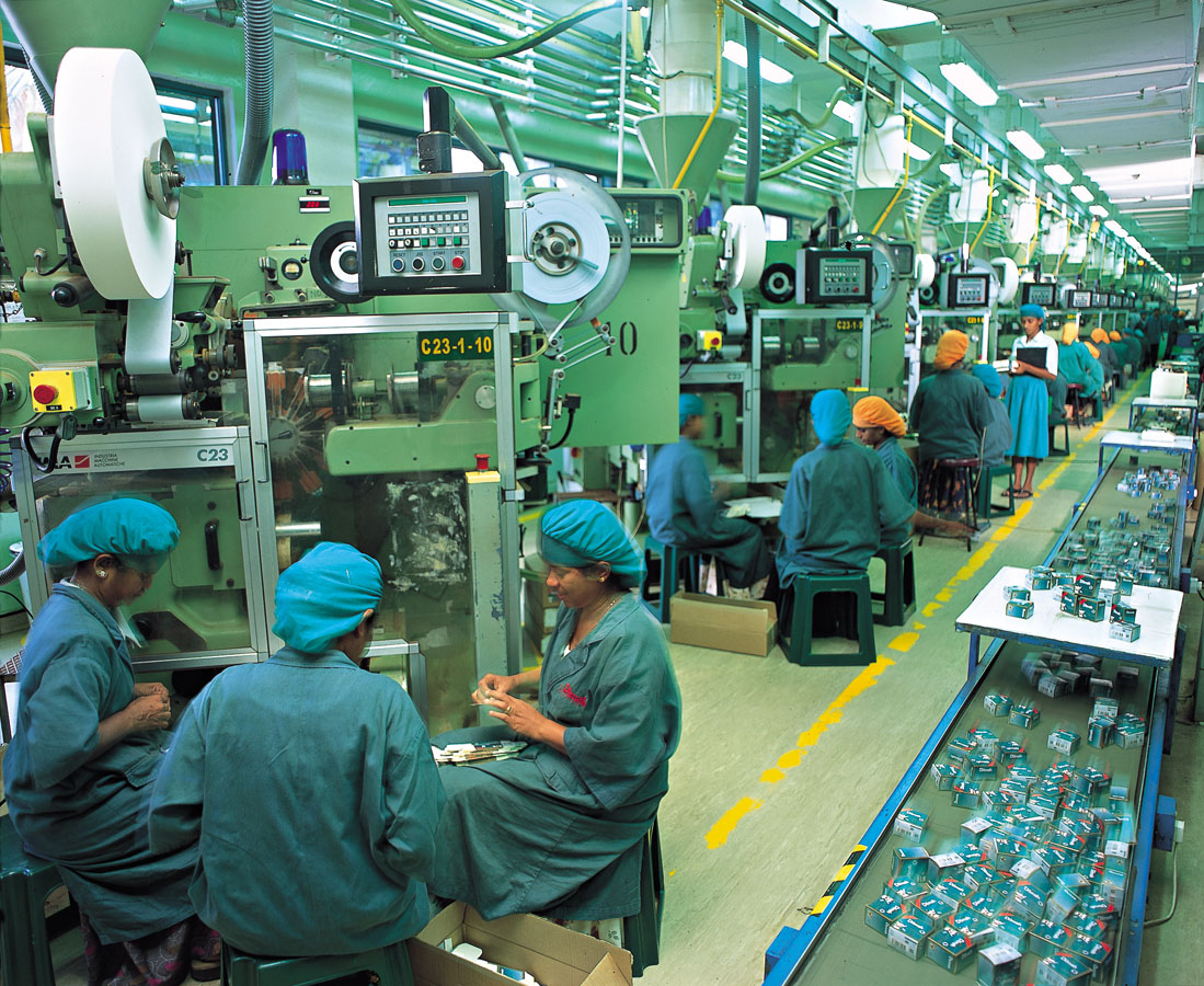 Dilmah tea factory interior machines workers