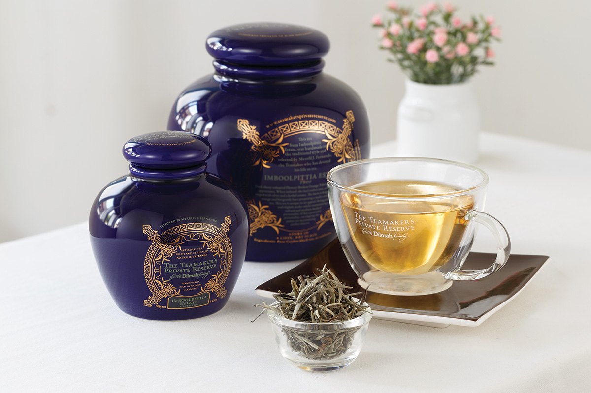 Tea Makers Private Reserve ceramic packs white tea leaves and glass cup of tea