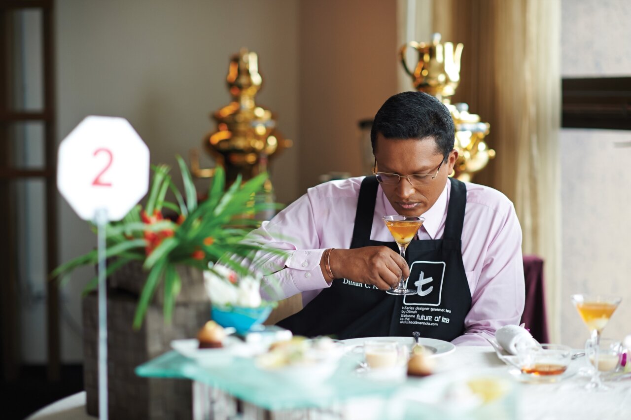 Dilhan C Fernando tasting tea at Real High Tea Challenge