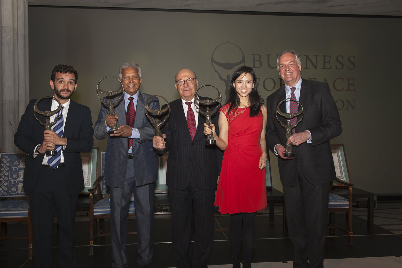 Merrill J Fernando and four other people holding Oslo Business for Peace Award