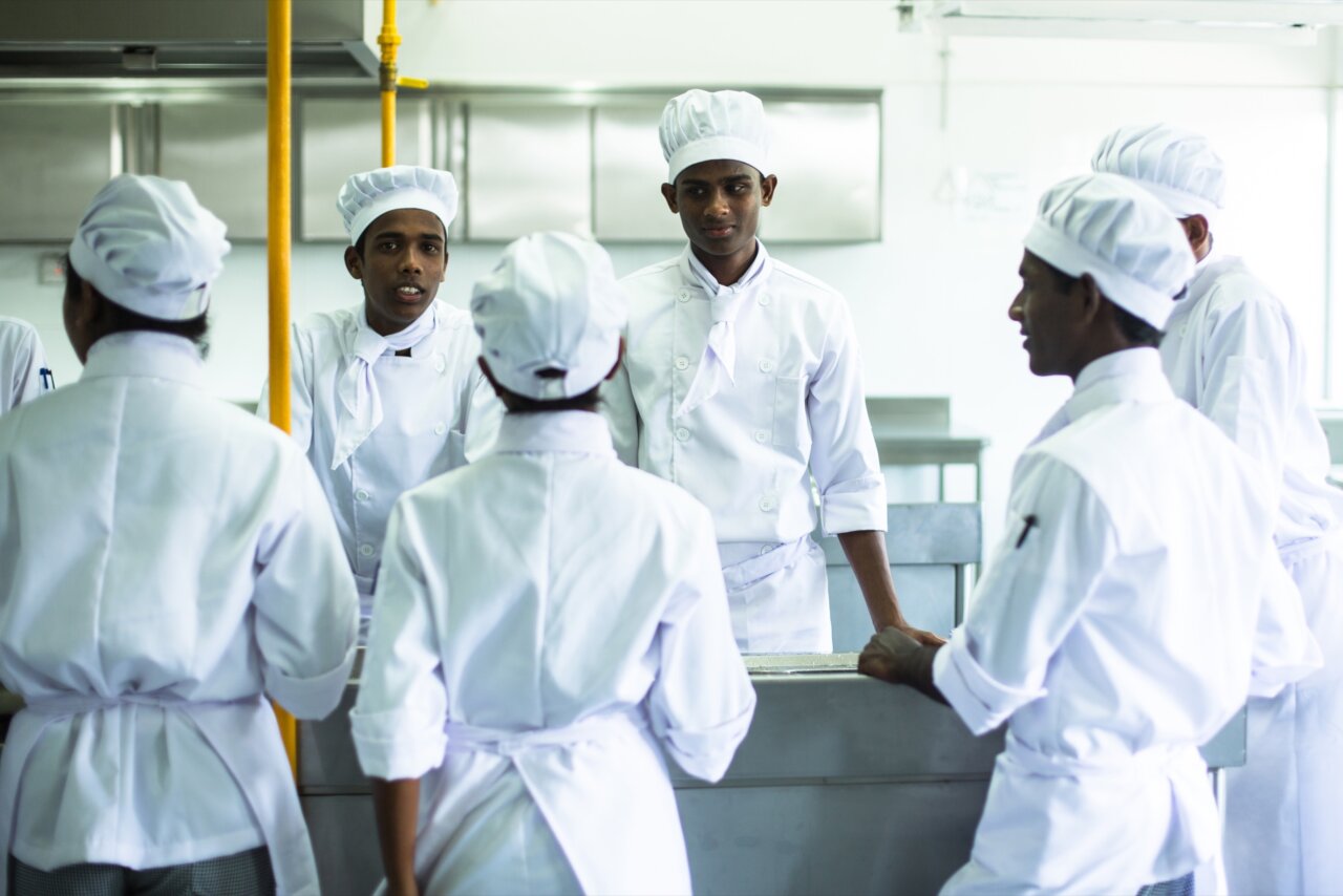 Six people in The Empower Culinary & Hospitality School